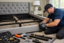 Professional assembling an Ashley Furniture bed frame in a Boca Raton bedroom