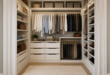 Clean and well-organized closet with neatly arranged clothes, shelves, and storage solutions